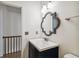 Updated bathroom featuring new vanity, decorative mirror, and modern fixtures at 3115 W Fair Oaks Ave, Tampa, FL 33611
