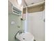 Small bathroom featuring a corner sink, white shower, and simple wall-mounted storage at 3115 W Fair Oaks Ave, Tampa, FL 33611