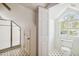 Bathroom featuring walk-in shower and toilet area with patterned tile flooring at 3115 W Fair Oaks Ave, Tampa, FL 33611