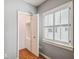 Bedroom featuring gray walls, hardwood floors, built in closet and shuttered window at 3115 W Fair Oaks Ave, Tampa, FL 33611