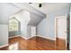 Bedroom with hardwood floors, a window, grey walls, and a vaulted ceiling at 3115 W Fair Oaks Ave, Tampa, FL 33611