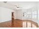 Spacious bedroom with hardwood floors, bay windows, and a ceiling fan at 3115 W Fair Oaks Ave, Tampa, FL 33611