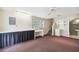 Bonus room with a large workspace, access to a bathroom, stairs and a mini-fridge at 3115 W Fair Oaks Ave, Tampa, FL 33611