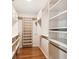 Spacious walk-in closet with custom shelving and hardwood flooring at 3115 W Fair Oaks Ave, Tampa, FL 33611