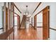 Grand foyer featuring hardwood floors, elegant staircase, wood trim, and natural light, creating a welcoming entrance at 3115 W Fair Oaks Ave, Tampa, FL 33611