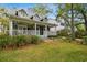 Charming two-story home with a large front porch and well-maintained landscaping at 3115 W Fair Oaks Ave, Tampa, FL 33611