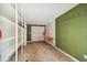 Garage interior with shelving, work bench, green accent wall, and white walls at 3115 W Fair Oaks Ave, Tampa, FL 33611