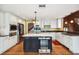 Bright kitchen featuring custom cabinets, stainless appliances, and a large island with a beverage center at 3115 W Fair Oaks Ave, Tampa, FL 33611
