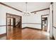 Open living room with hardwood floors and trim and open staircase at 3115 W Fair Oaks Ave, Tampa, FL 33611