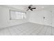 Bright living room with tile floors and neutral color walls at 3248 Rock Valley Dr, Holiday, FL 34691