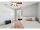 Comfortable bedroom featuring gray walls, a plush bed, and ample natural light at 349 Shirley Ave, Belleair, FL 33756