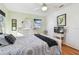Comfortable bedroom with a calming color scheme, ample lighting, and hardwood floors at 349 Shirley Ave, Belleair, FL 33756