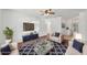 Bright living room features a modern ceiling fan, stylish decor, and comfortable seating at 3915 N Ola Ave, Tampa, FL 33603