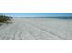 Expansive beach with clear blue ocean views and soft, light-colored sand at 4550 Plaza Way, St Pete Beach, FL 33706
