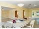Bright dining room with yellow walls and views into adjoining living spaces at 4550 Plaza Way, St Pete Beach, FL 33706