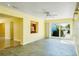 Open living area with tile floors and large windows offering natural light at 4550 Plaza Way, St Pete Beach, FL 33706