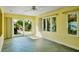 Inviting room with tile flooring, light walls, and multiple windows bringing the outside in at 4550 Plaza Way, St Pete Beach, FL 33706