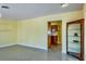 Open living room featuring yellow walls, tiled floors, and a view of the kitchen at 4550 Plaza Way, St Pete Beach, FL 33706