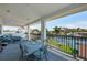 Comfortable balcony with a small bistro table and chairs overlooking the water at 4937 Dover Ne St, St Petersburg, FL 33703
