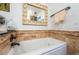 A cozy bathroom with a soaking tub and decorative accents creating a peaceful and relaxing atmosphere at 4937 Dover Ne St, St Petersburg, FL 33703