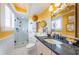 Bright bathroom featuring a glass-enclosed shower, decorative mirror, and ample counter space at 4937 Dover Ne St, St Petersburg, FL 33703
