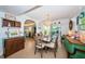 Charming dining room with an elegant chandelier and outdoor views, ideal for Gathering meals and gatherings at 4937 Dover Ne St, St Petersburg, FL 33703