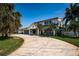 Charming two-story home featuring a well-manicured lawn and attractive curb appeal at 4937 Dover Ne St, St Petersburg, FL 33703