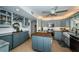 Contemporary kitchen with ample storage, a central island, and modern finishes that blend style and functionality at 4937 Dover Ne St, St Petersburg, FL 33703