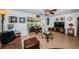 Comfortable living room with tile floors, leather furniture, and a view into another sitting area at 4937 Dover Ne St, St Petersburg, FL 33703