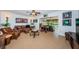 Spacious living room with tile floors, leather furniture, and many decorations at 4937 Dover Ne St, St Petersburg, FL 33703