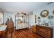 Well-lit bedroom with hardwood floors and a canopy bed at 4937 Dover Ne St, St Petersburg, FL 33703