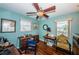 Well-lit home office with hardwood floors, plenty of desk space, and a view of the canal at 4937 Dover Ne St, St Petersburg, FL 33703