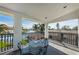 A covered terrace with wrought iron railings overlooking the waterway at 4937 Dover Ne St, St Petersburg, FL 33703