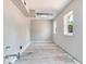 A bright basement has gray vinyl floors, white walls, and a window at 5020 S Shore Crest Cir, Tampa, FL 33609