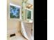 Cozy bathroom featuring vintage vanity, updated fixtures, and natural light from two windows at 5020 S Shore Crest Cir, Tampa, FL 33609