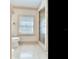Clean bathroom with toilet and shower with glass enclosure at 5020 S Shore Crest Cir, Tampa, FL 33609