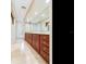 Spacious bathroom vanity with wood cabinets and a large mirror at 5020 S Shore Crest Cir, Tampa, FL 33609