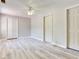 This spacious bedroom features light wood floors, a ceiling fan, and ample closet space at 5020 S Shore Crest Cir, Tampa, FL 33609
