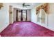 Bedroom with floral curtains, wallpaper and carpet at 5020 S Shore Crest Cir, Tampa, FL 33609
