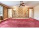 Bedroom with a floral wallpaper, plush carpet, and ample space at 5020 S Shore Crest Cir, Tampa, FL 33609