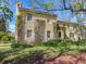 Charming stucco home featuring many windows and climbing vines at 5020 S Shore Crest Cir, Tampa, FL 33609
