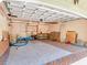 Spacious garage with tiled floor, built-in shelves, and ample storage space at 5020 S Shore Crest Cir, Tampa, FL 33609
