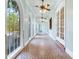 Long hallway with arched windows and doors plus tile flooring at 5020 S Shore Crest Cir, Tampa, FL 33609