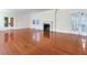 Spacious living room with gleaming hardwood floors, marble fireplace, and beautiful French doors at 5020 S Shore Crest Cir, Tampa, FL 33609