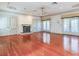 Living room with hardwood floors, fireplace and lots of natural light at 5020 S Shore Crest Cir, Tampa, FL 33609