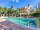 Enjoy the sun by the pool in this stunning home, featuring brick pavers and lush greenery, perfect for outdoor relaxation at 5020 S Shore Crest Cir, Tampa, FL 33609