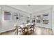 Dining room with hardwood floors, modern furniture, and ample natural light with a nice view of the pool area at 5317 Del Coronado Dr, Apollo Beach, FL 33572