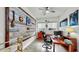 Comfortable office space with a wood accent wall, ceiling fan, and plenty of room for productivity at 5317 Del Coronado Dr, Apollo Beach, FL 33572