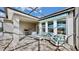 Inviting covered patio featuring comfortable seating and a view of the landscaped backyard at 5317 Del Coronado Dr, Apollo Beach, FL 33572