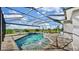 Screened-in pool area with patio furniture and a scenic view of the surrounding landscape at 5317 Del Coronado Dr, Apollo Beach, FL 33572